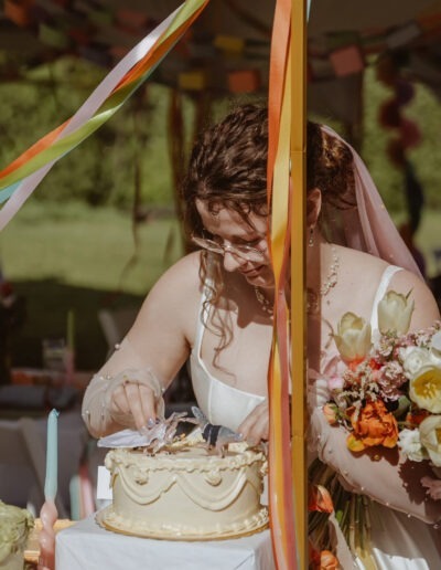 A bride getting up close with her wedding cake