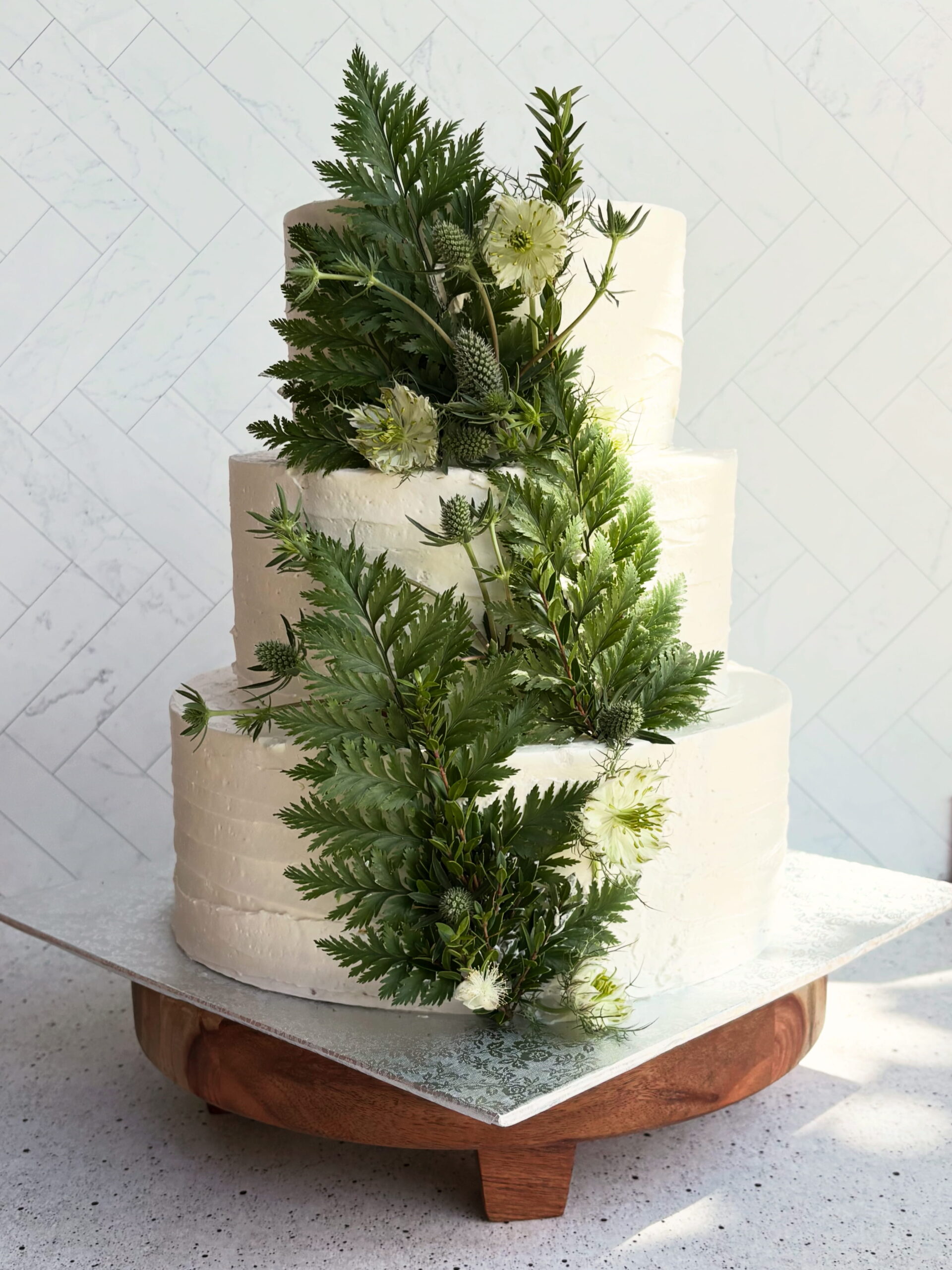 Two-tiered wedding cake with fruit layers inside